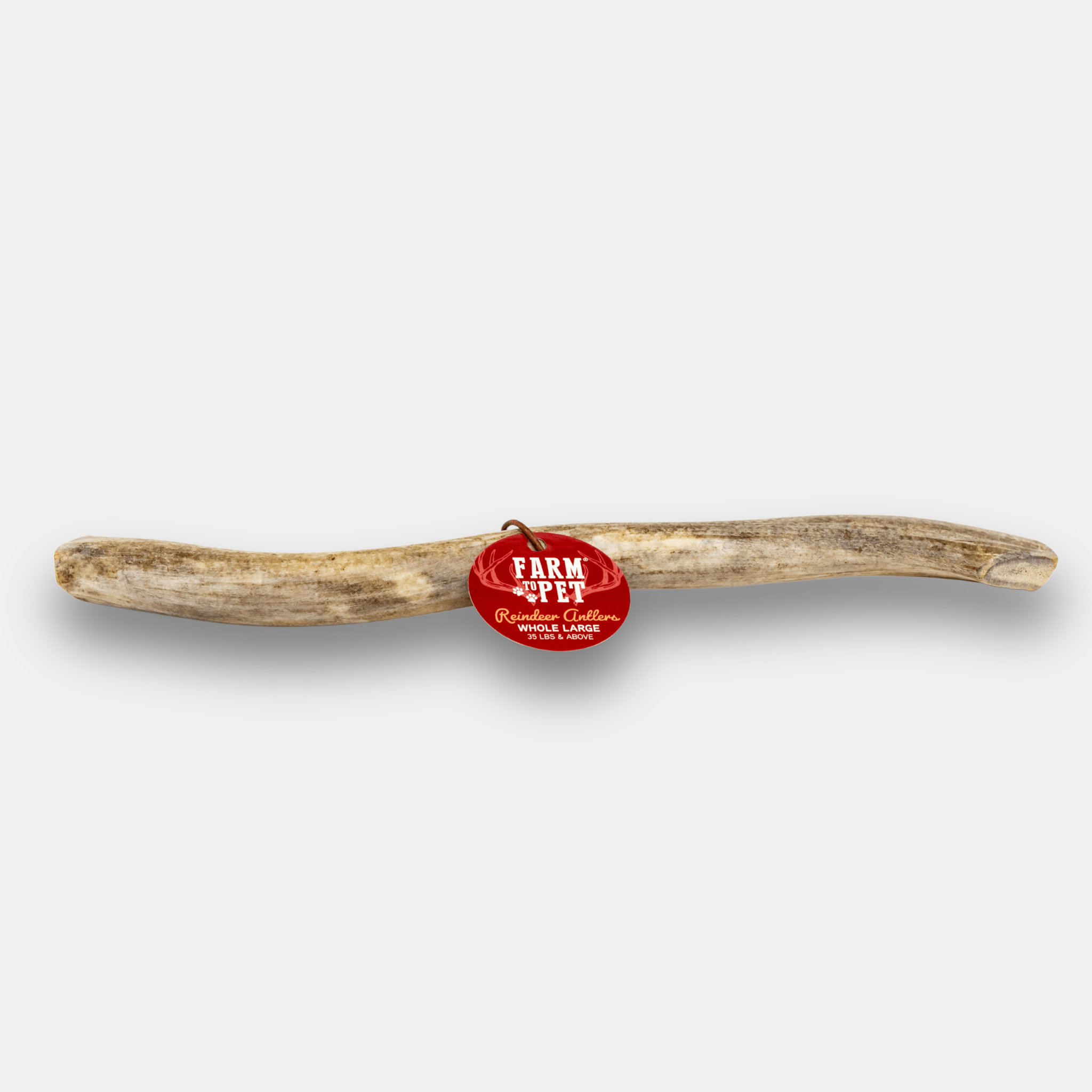 Reindeer antler with a red 'Farm to Pet' tag on a white background.