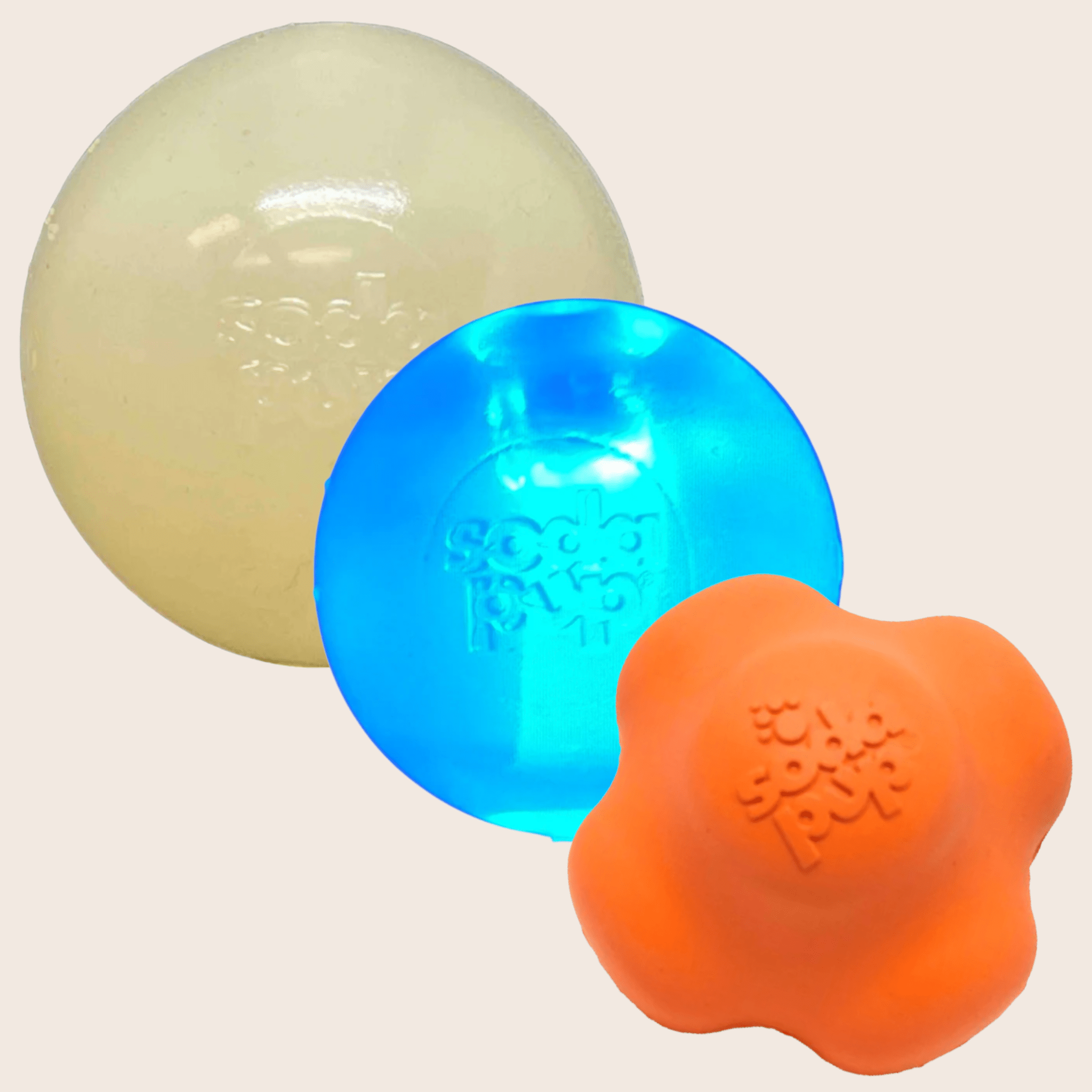 Farm to Pet Dog Fetch Balls Three colorful rubber balls on a beige background