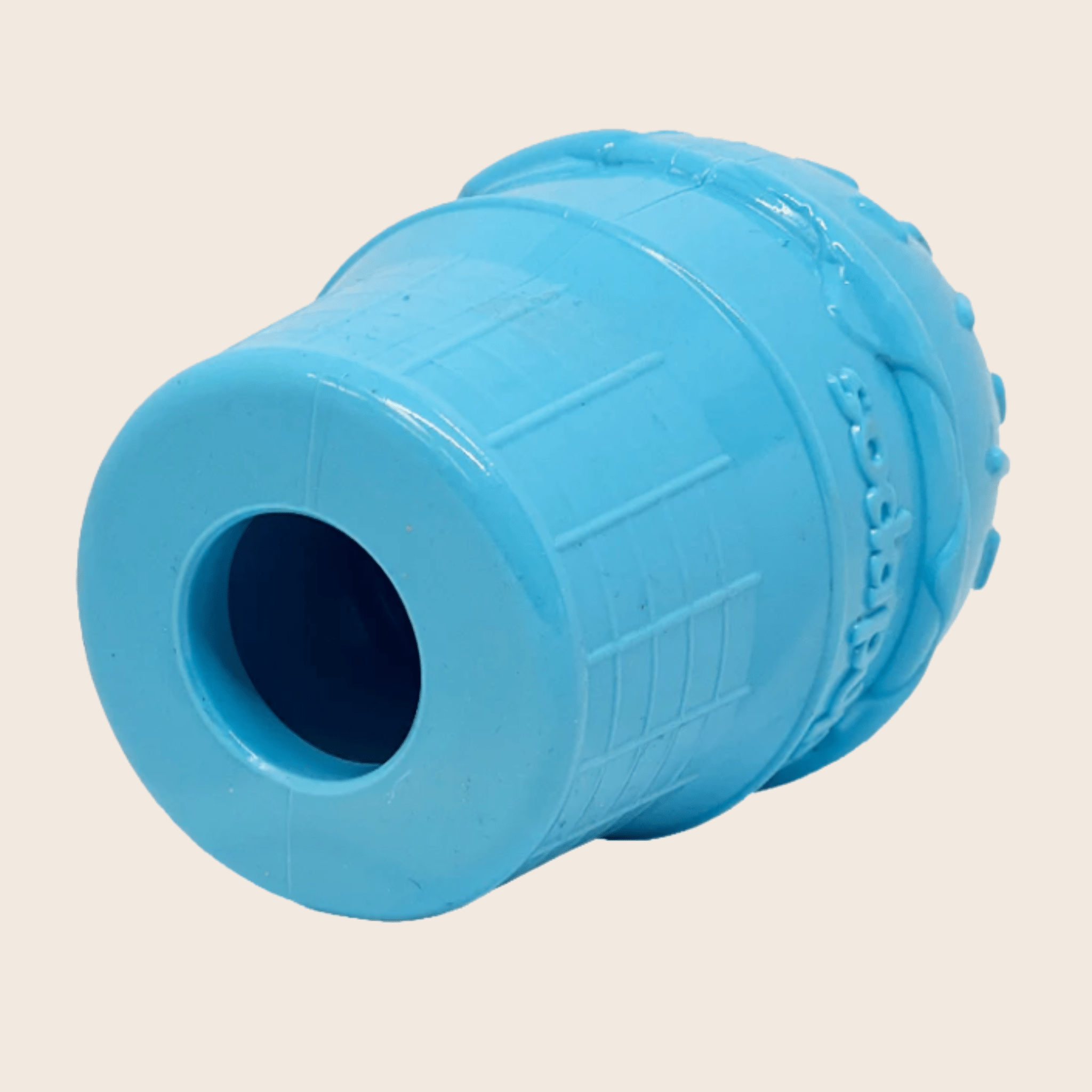 Farm to Pet Dog Treat Dispenser Blue ice cream bottom view with textured surface on a beige background