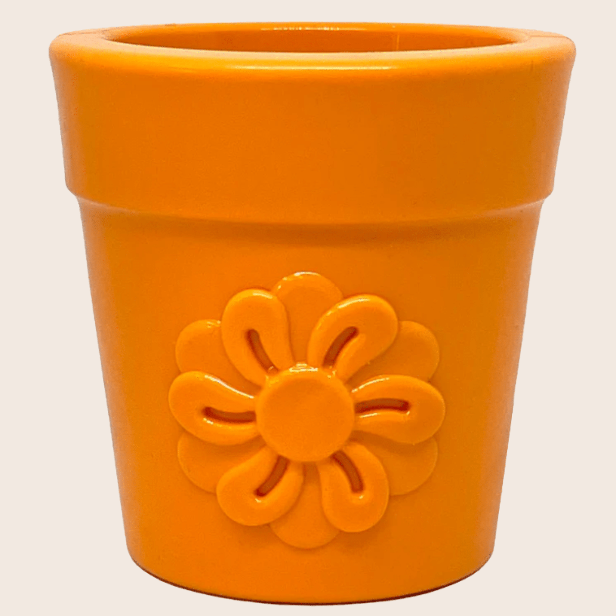 Farm to Pet Orange flower pot Dog Treat Dispenser with a sunflower design on front on a beige background.