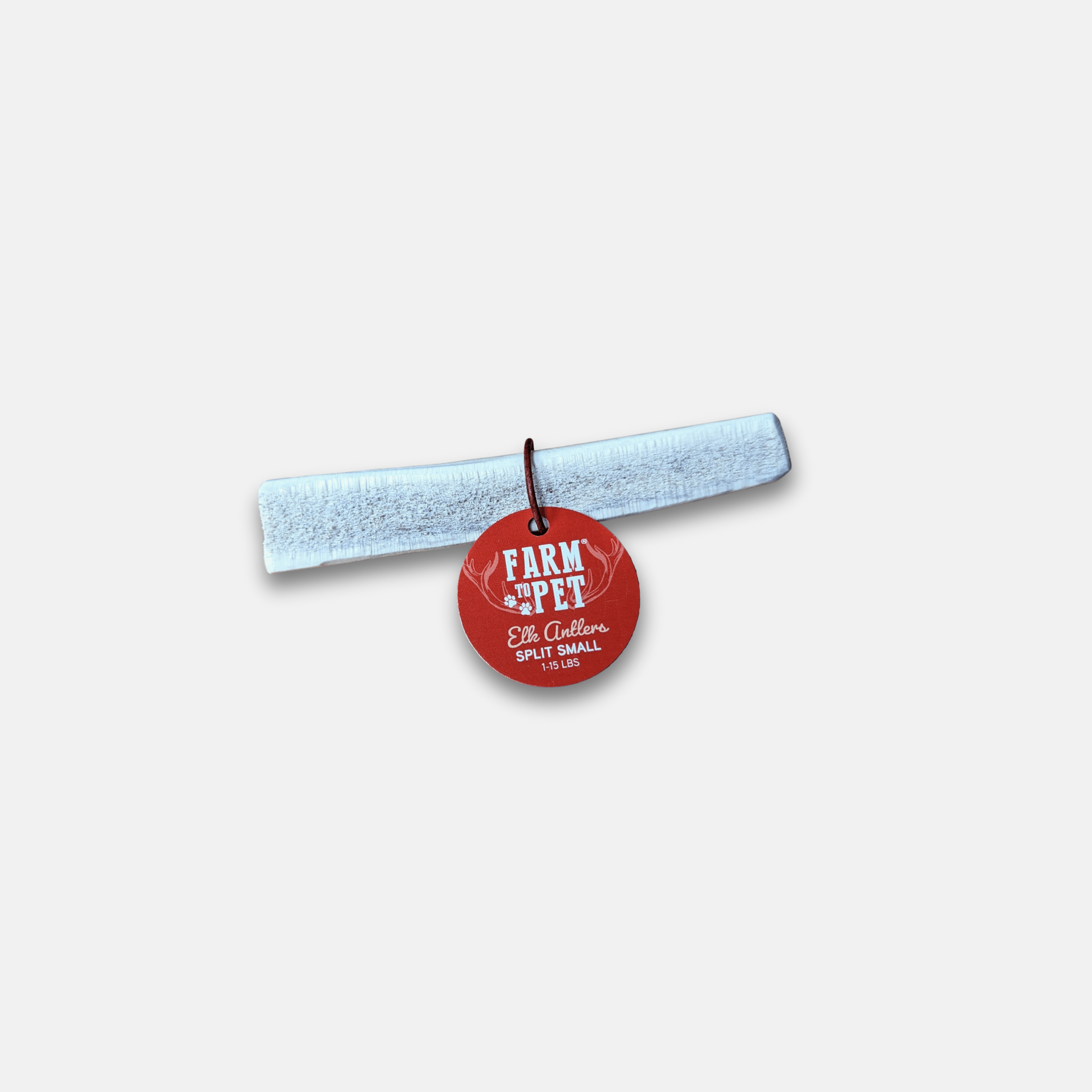 Red pet tag with 'Farm to Pet' text on Elk Antler a white background.