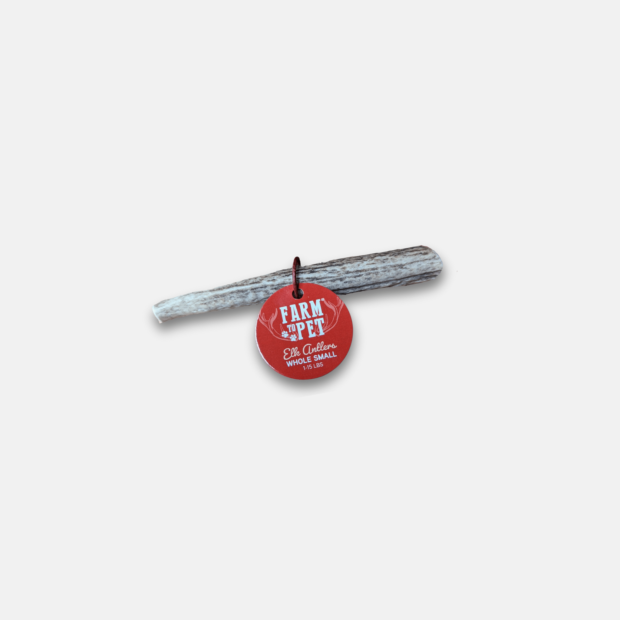 Elk Antler with a red tag with 'Farm to Pet' branding on a white background.