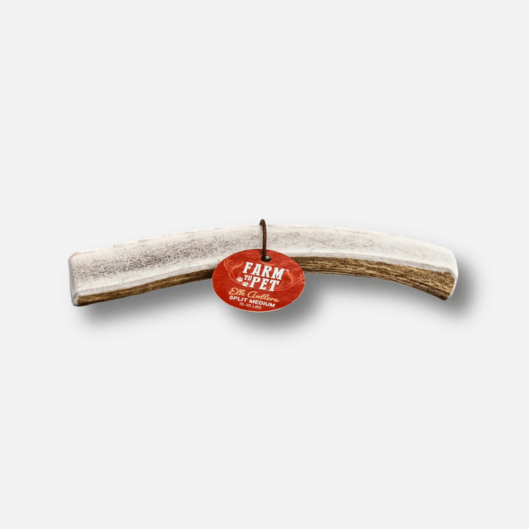 Farm to Pet Elk Antler with a red tag on a white background.