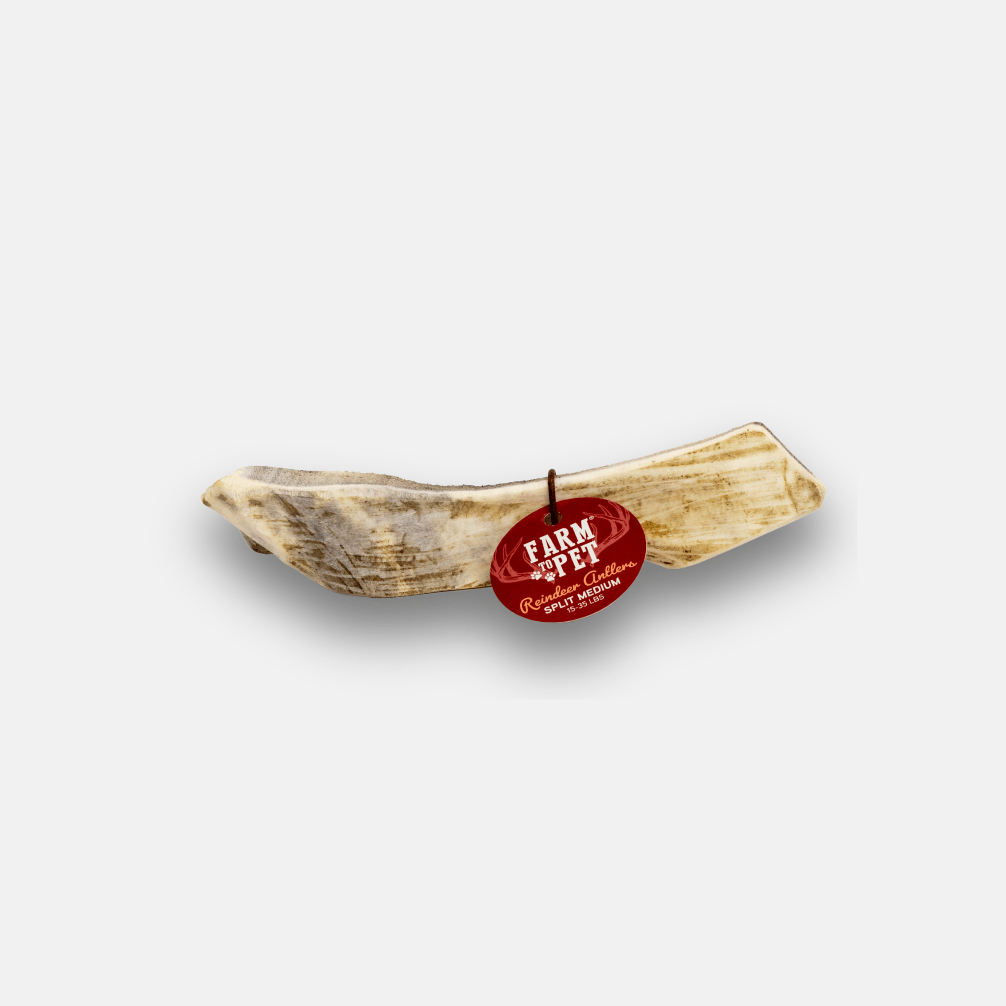 Reindeer antler chew with a red   'Farm to Pet' label on a white background.