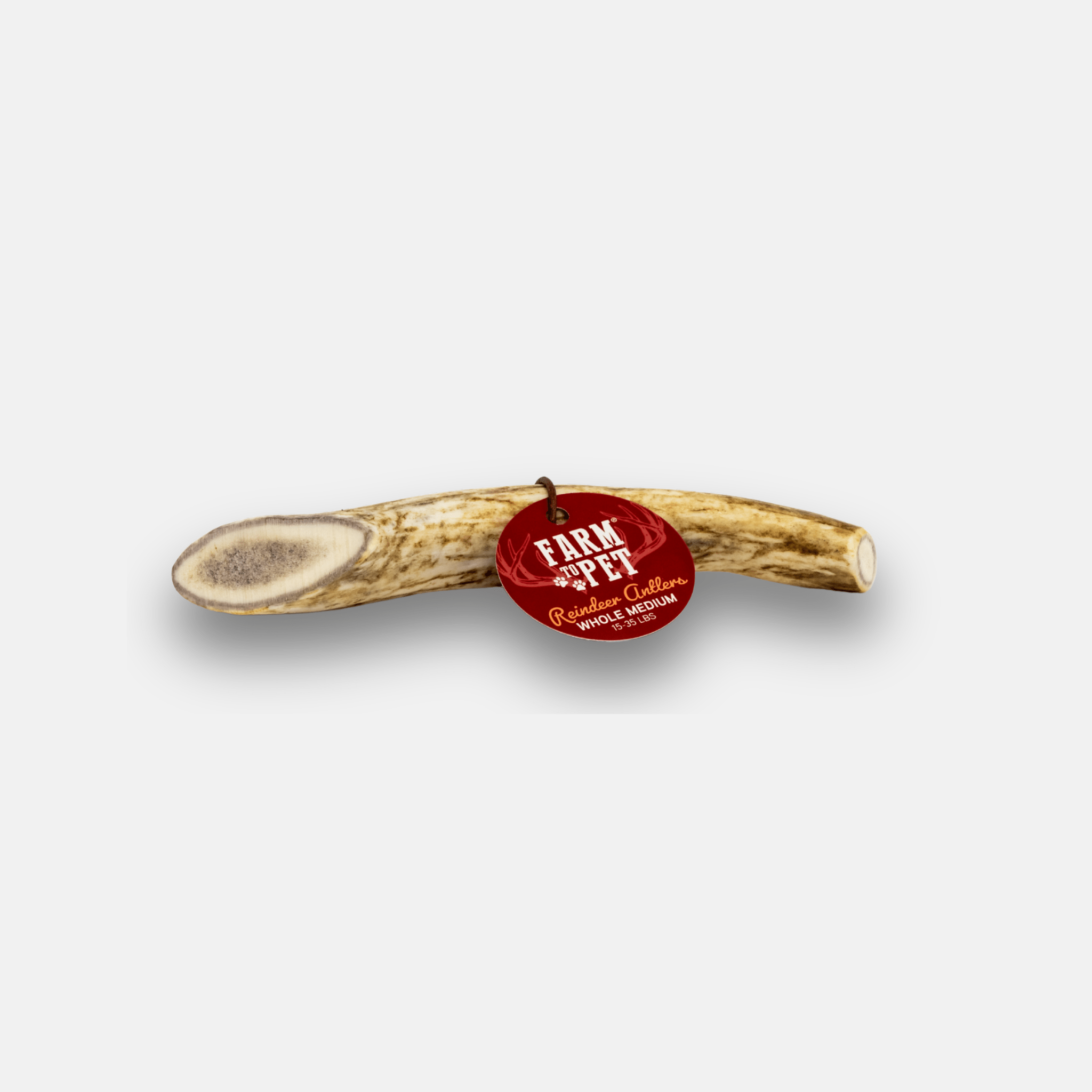 A reindeer antler with a red 'Farm Pet' tag on a white background.