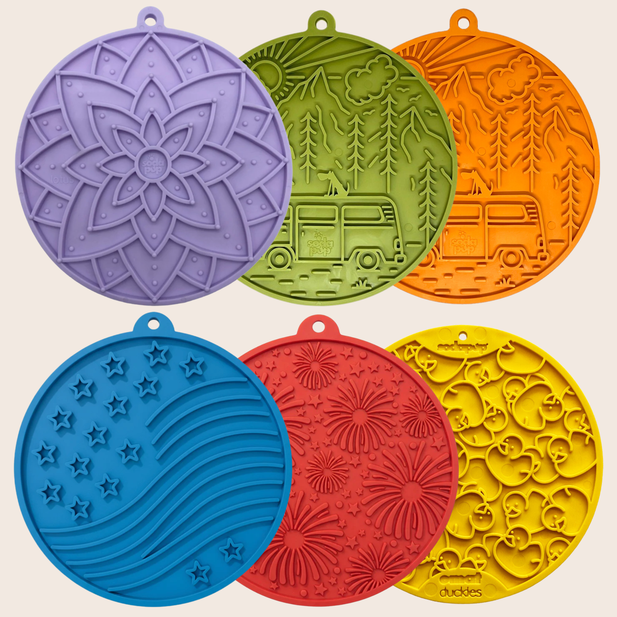 Set of six colorful lick mats for dogs with various patterns on a beige background
