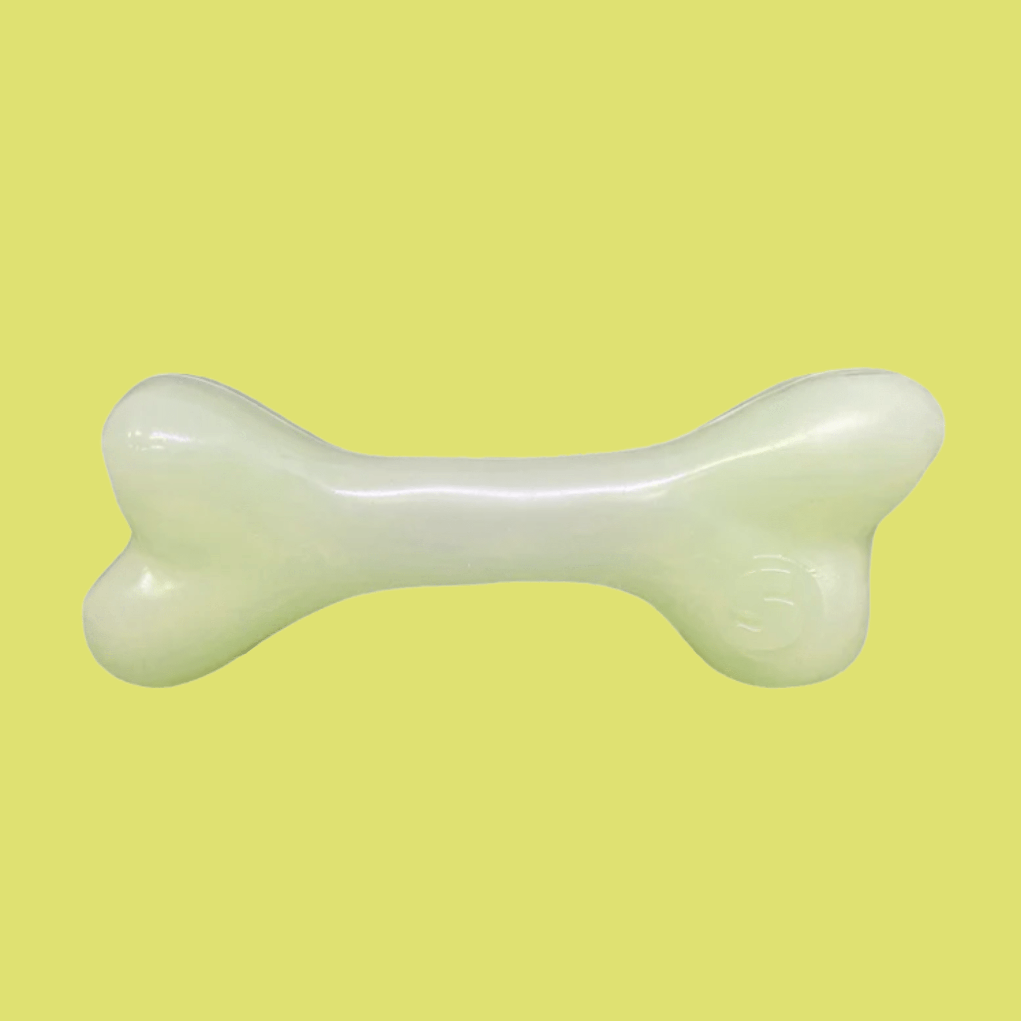 Farm to Pet Dog Treat Dispenser White bone-shaped on a yellow background.