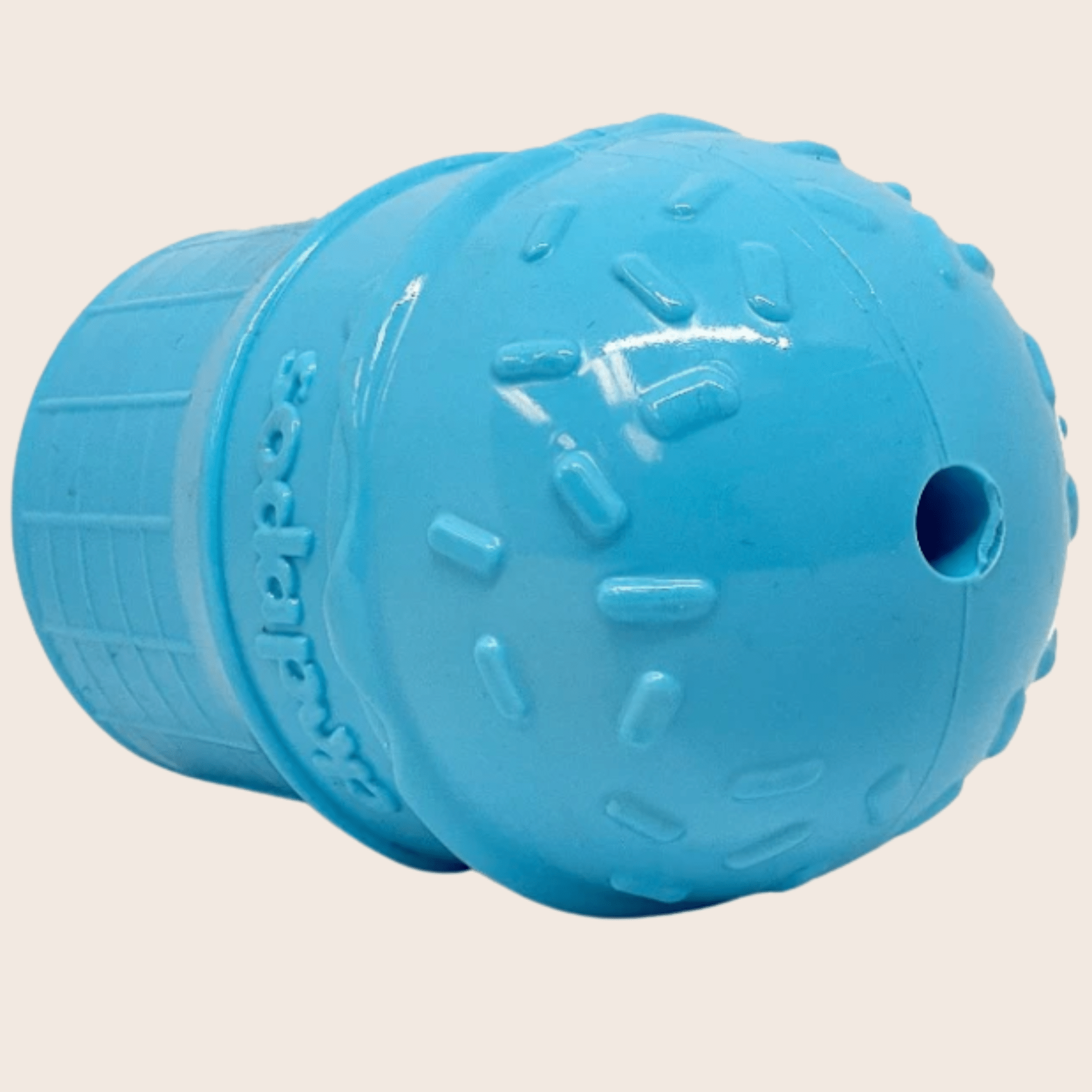 Farm to Pet Dog Treat Dispenser Blue  ice cream top view with a hole  on the top on a beige background