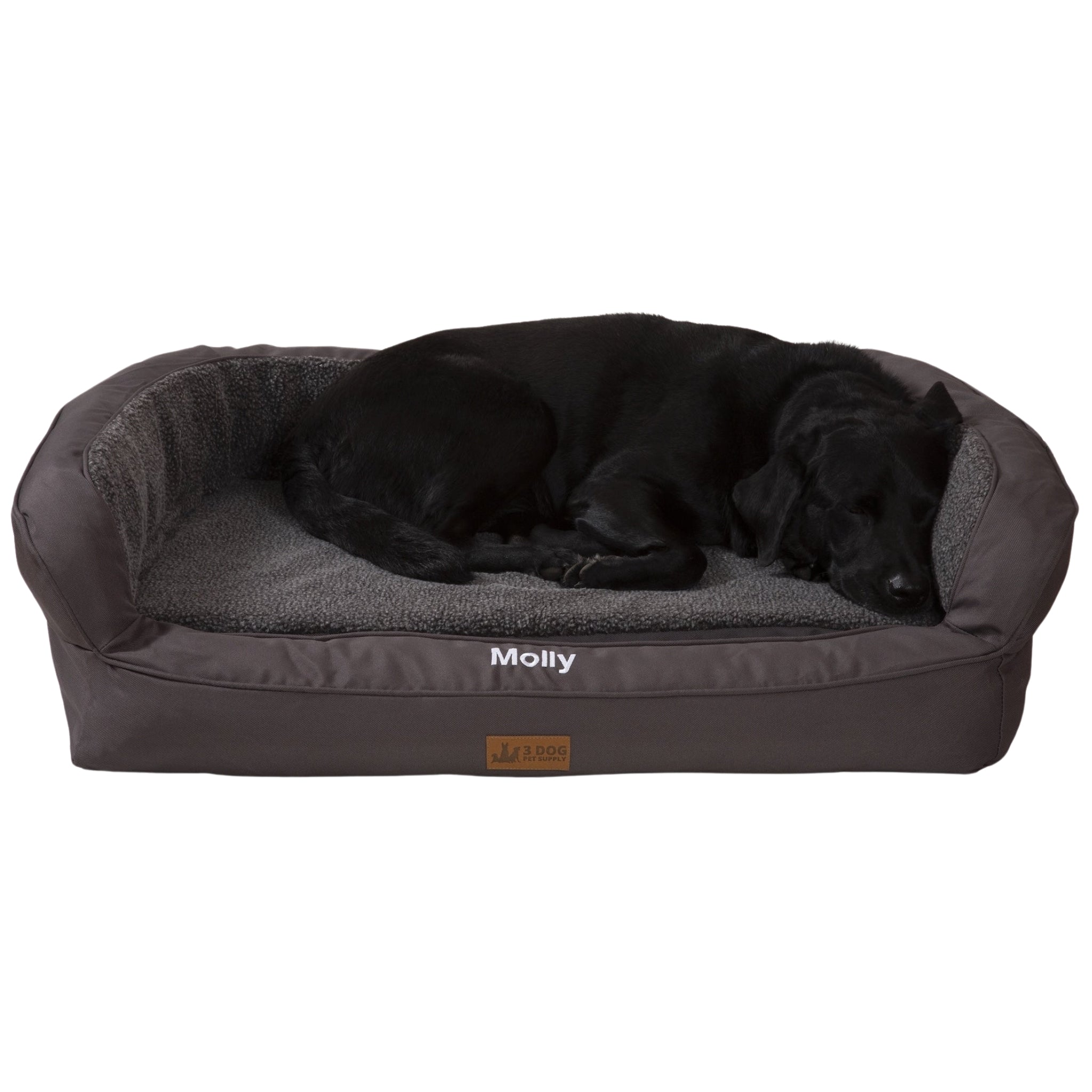 A Slate dog bed from Farm to Pet with a fleece headrest, featuring a lying dog with a relaxed expression.