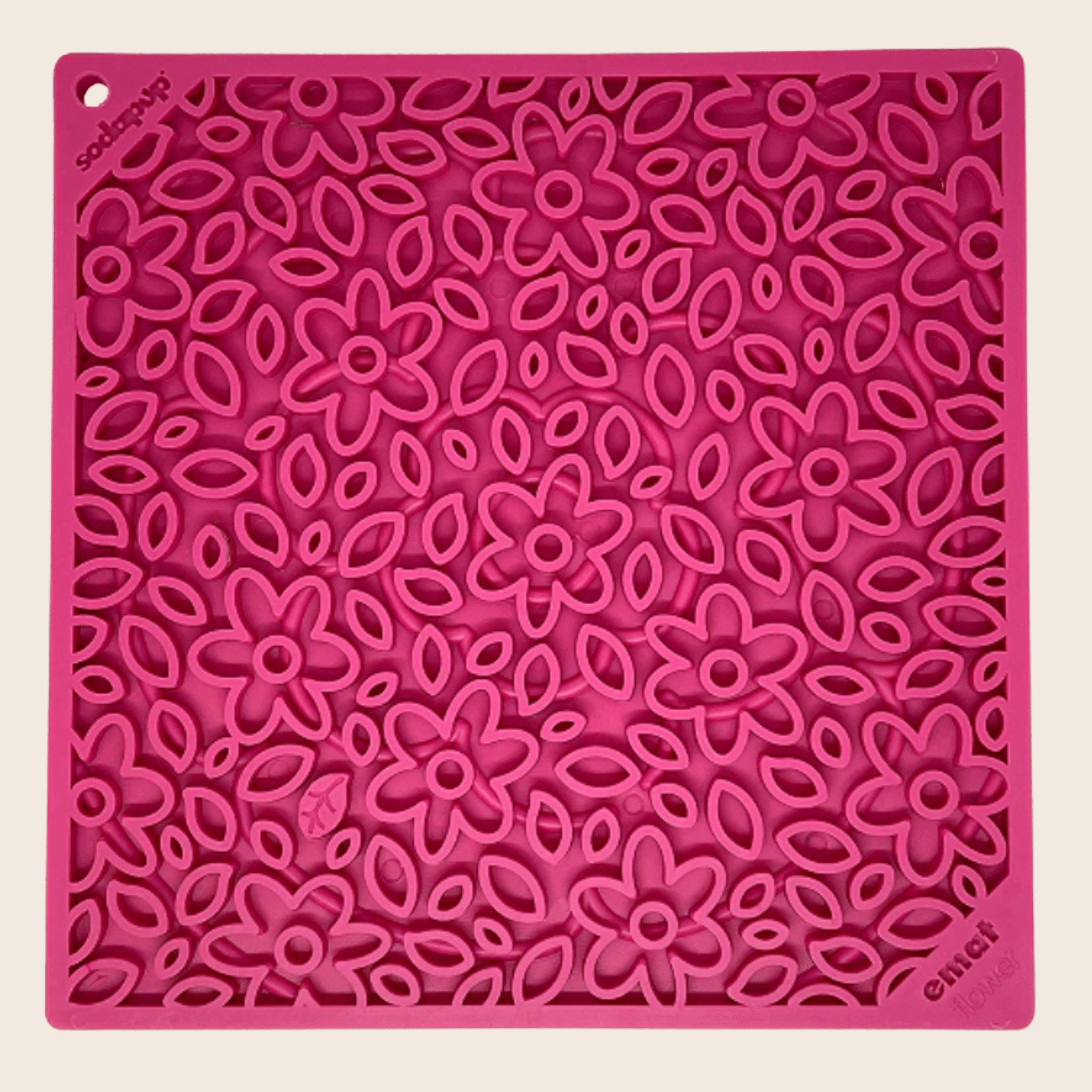 Farm to Pet Pink Flower Power  silicone  lick mat with floral pattern on a beige background.