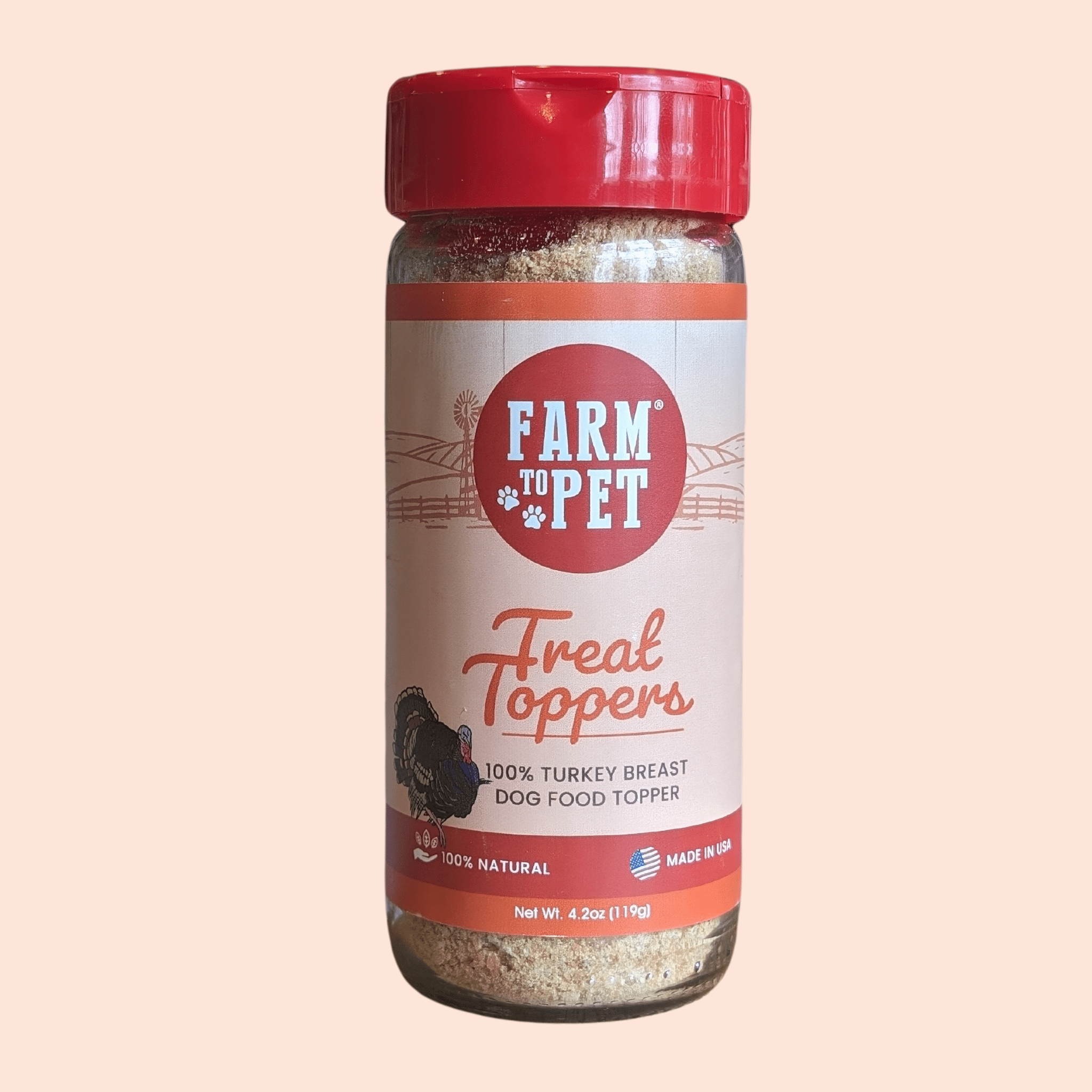 the front of a jar of Farm to Pet Treat Toppers on a light pink background.