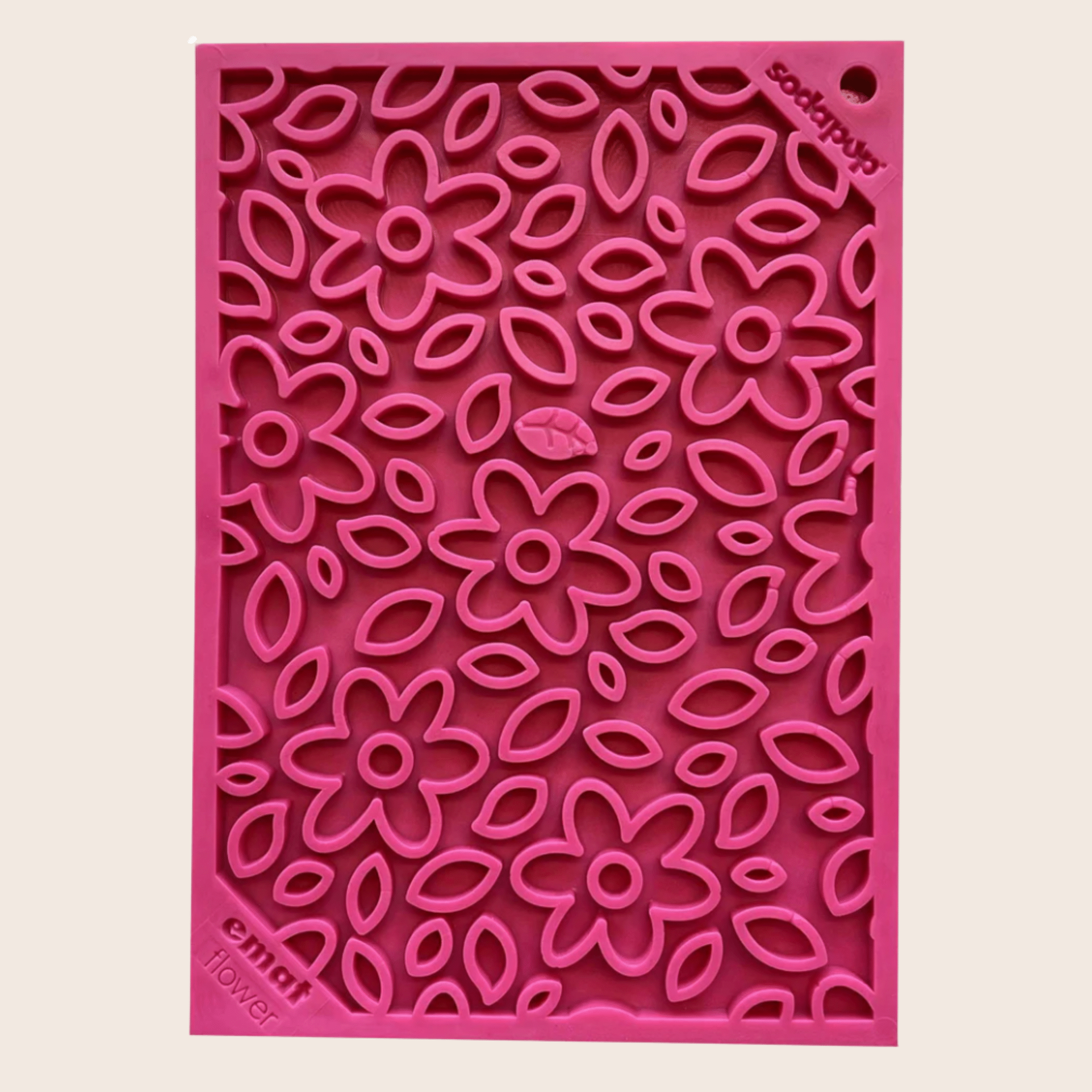 A Farm to Pet Pink Flower Power  textured lick mat with floral pattern on a beige background.