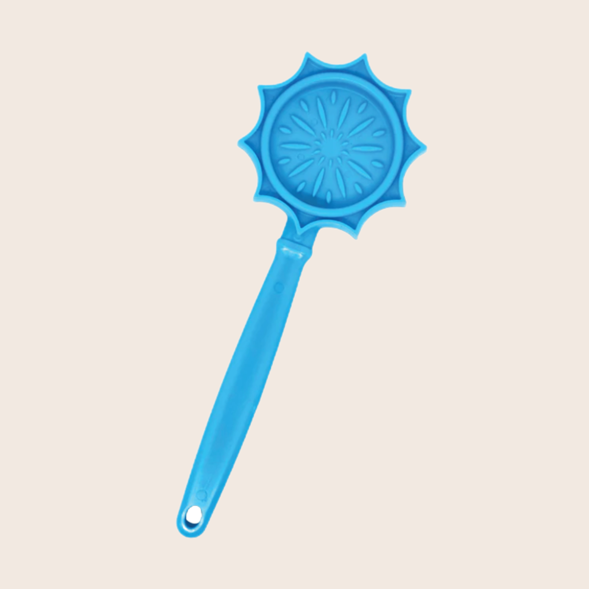 A Farm to Pet Lick Stick Blue Flower  with a handle on a beige background.