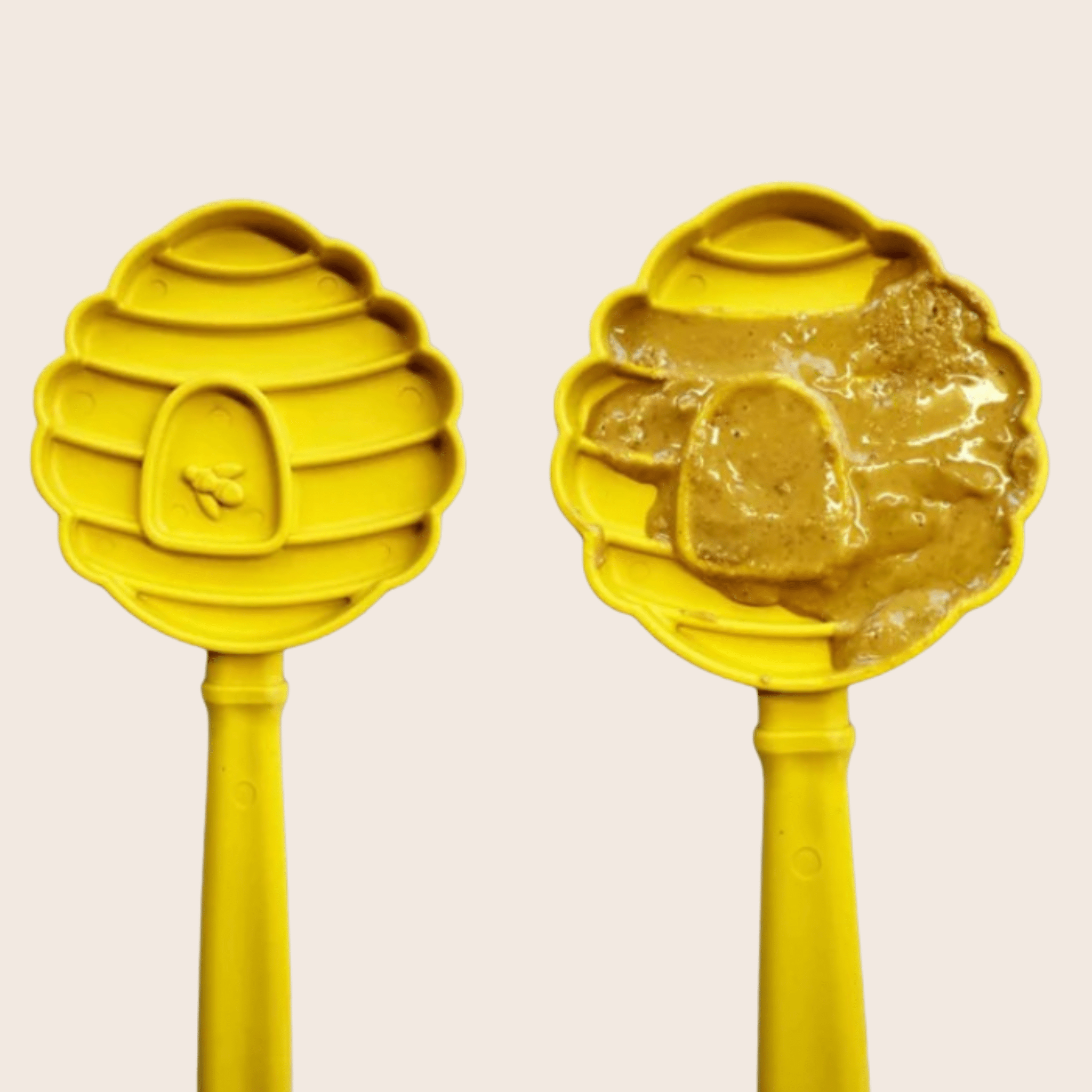 A Farm to Pet Lick Stick two yellow beehives one with honey on a beige background.