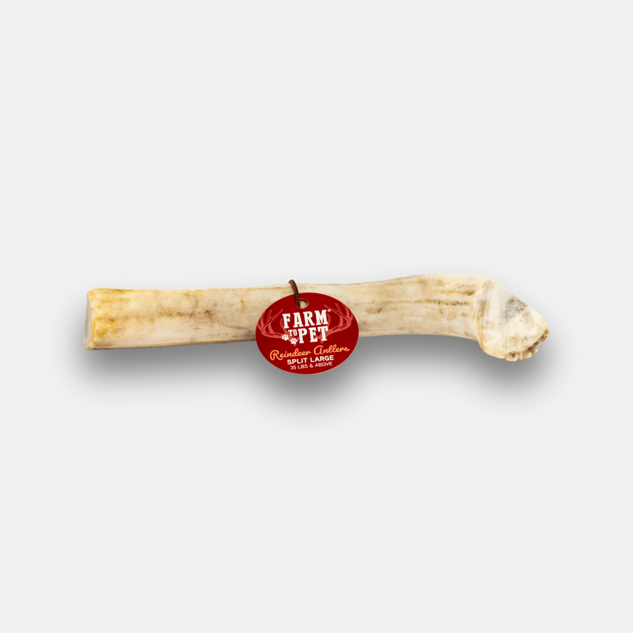 Reindeer antler dog chew treat with 'Farm to Pet' label on a white background.