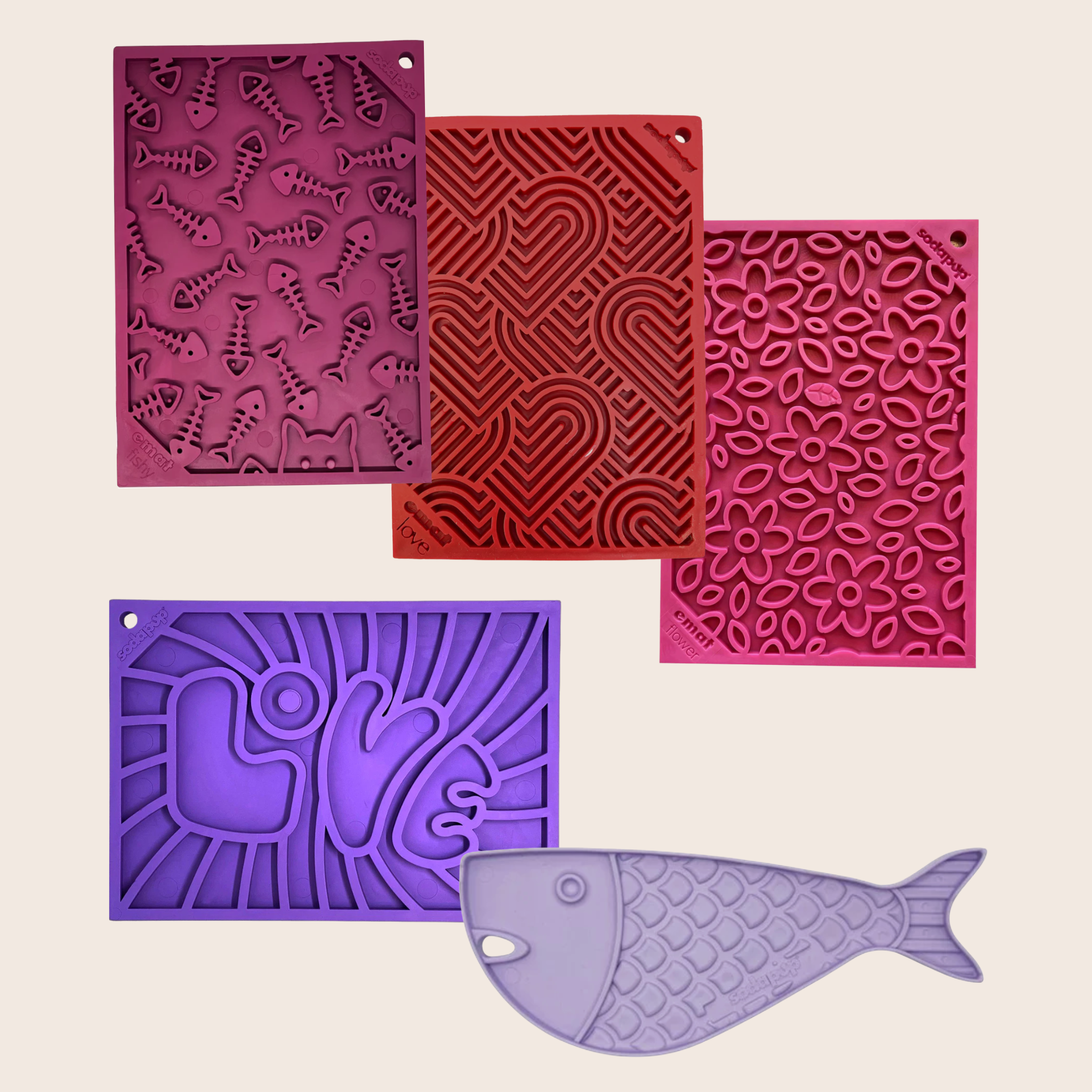 Five textured silicone lick mats from Farm to Pet in maroon, purple, lavender, red, and pink on a beige background.