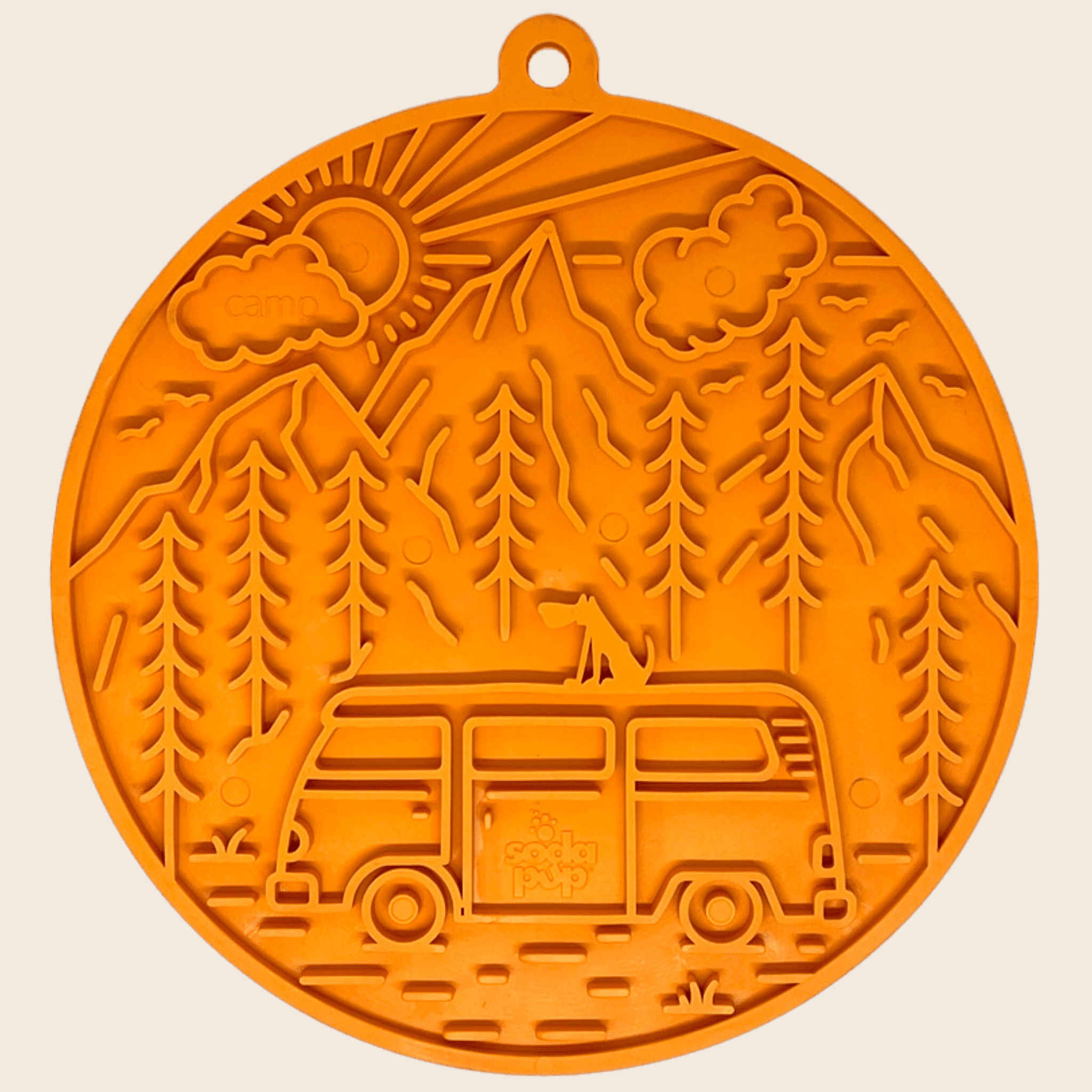A Farm to Pet Decorative round Orange Dog Lick Mat with a camper van, trees, and mountains on an orange background