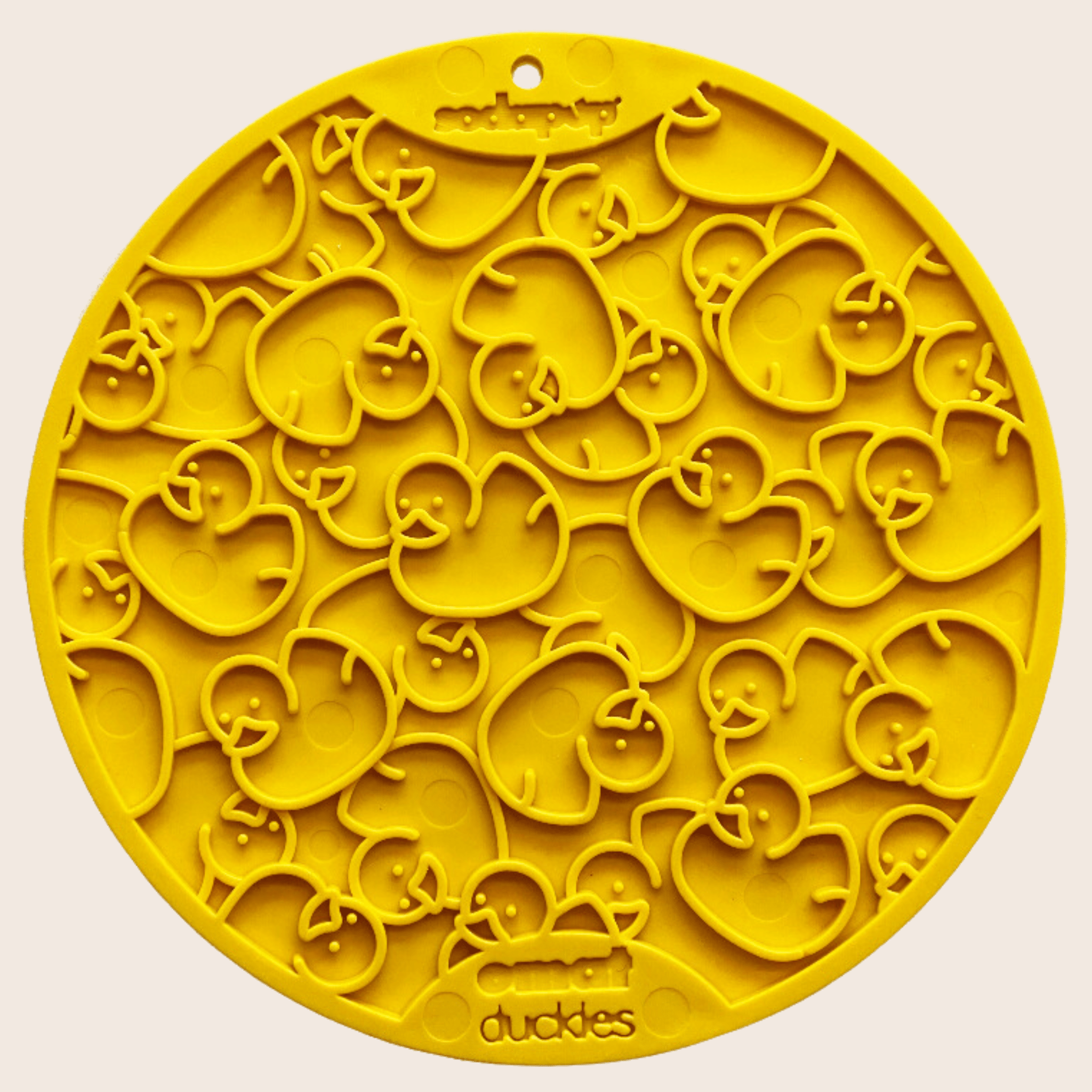 Farm to Pet Yellow round silicone lick mat with duck designs on a beige background.
