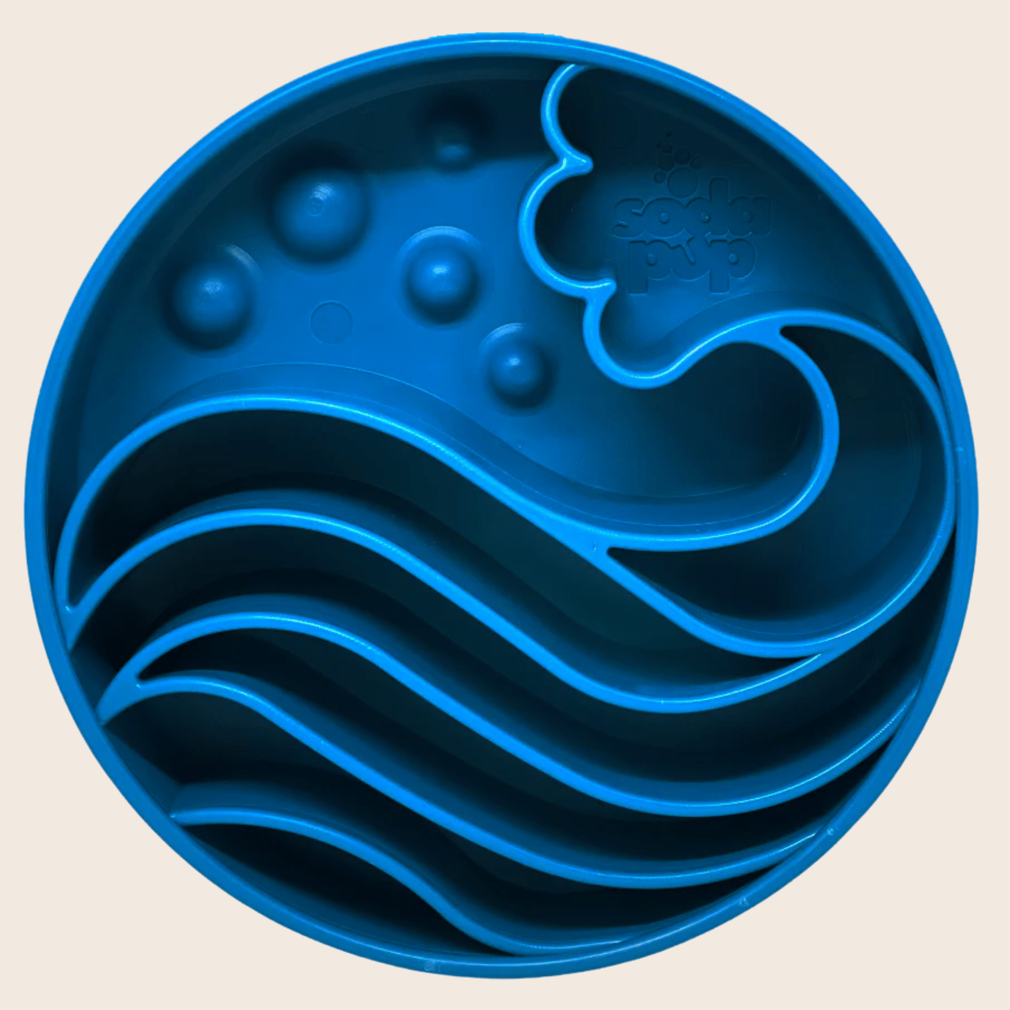 Farm to Pet Slow Feeder Dog Bowl in Blue Wave design on a beige background.