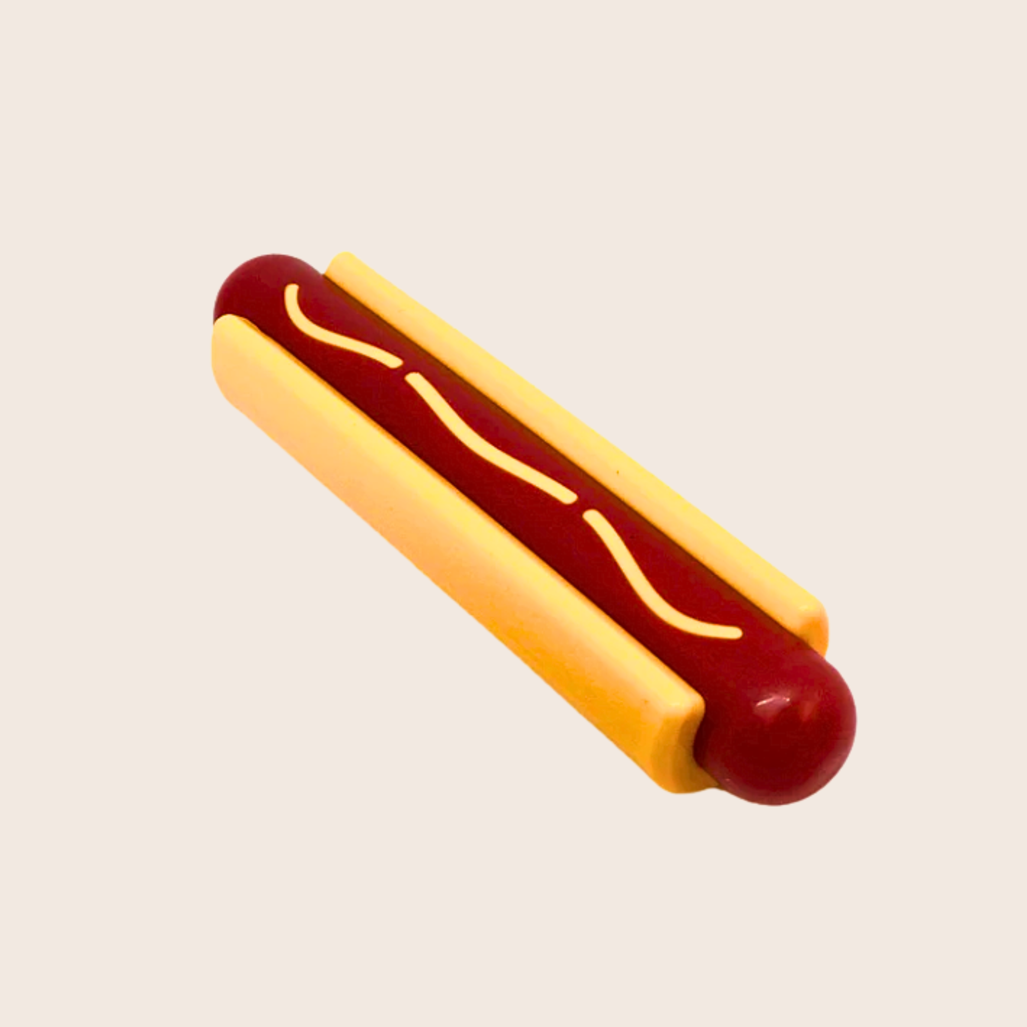 Hot dog with mustard chew toy on a beige background
