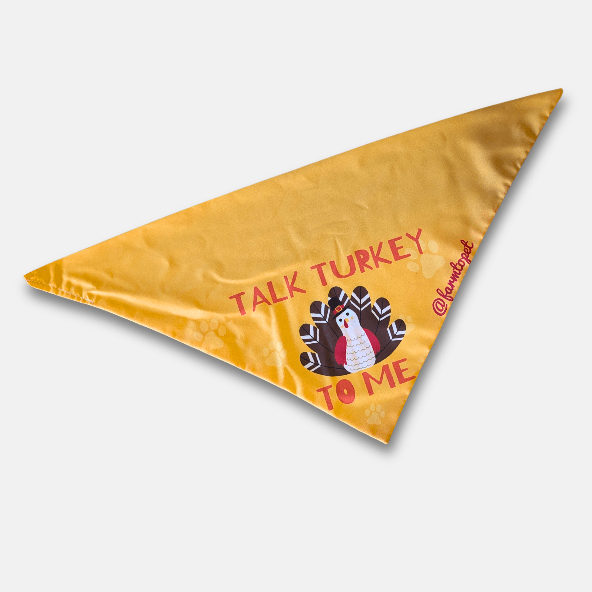 Triangle-shaped bandana from Farm to Pet with 'Talk Turkey to Me' text and a turkey graphic on a white background