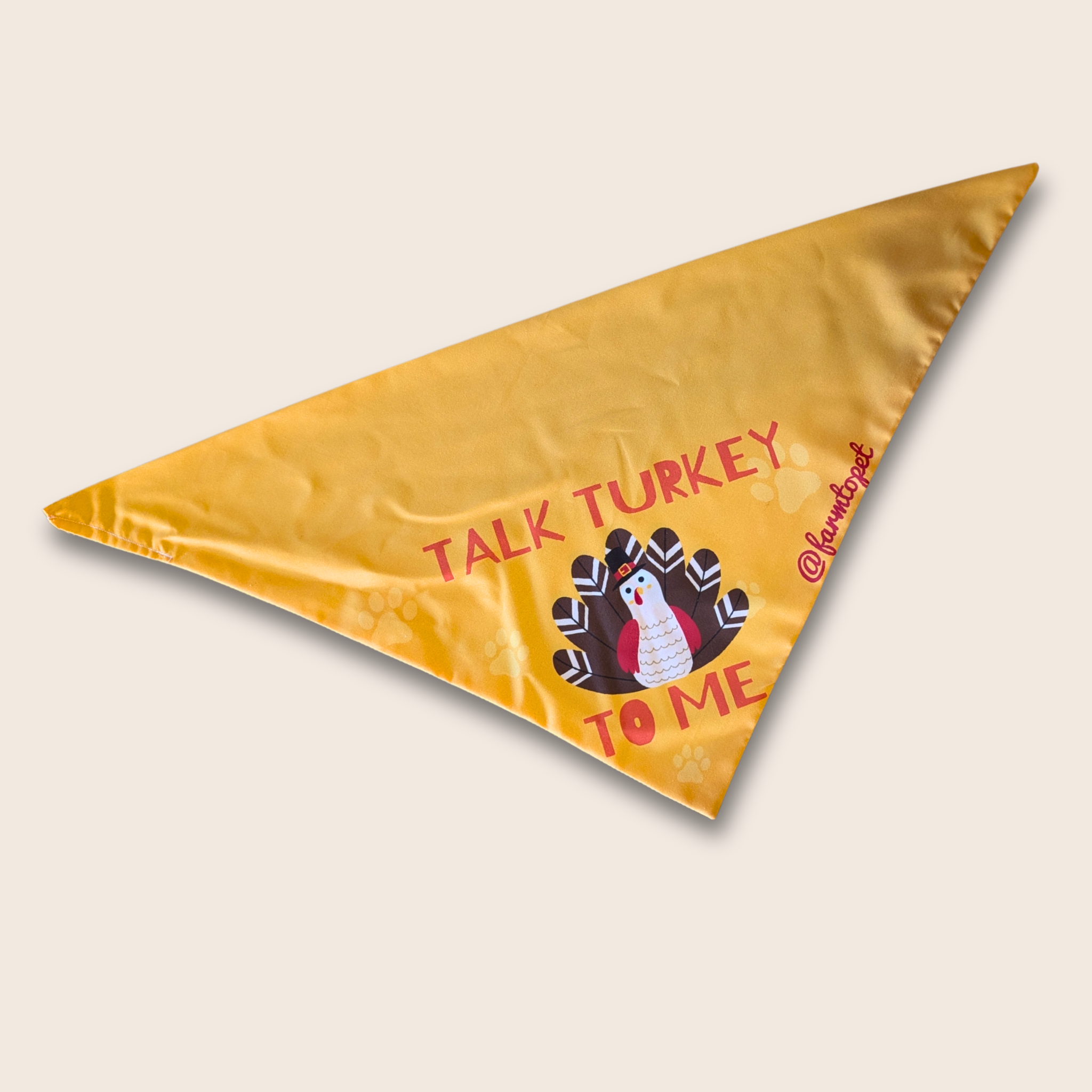 Triangle-shaped bandana from Farm to Pet with 'Talk Turkey to Me' text and a turkey graphic on a white background