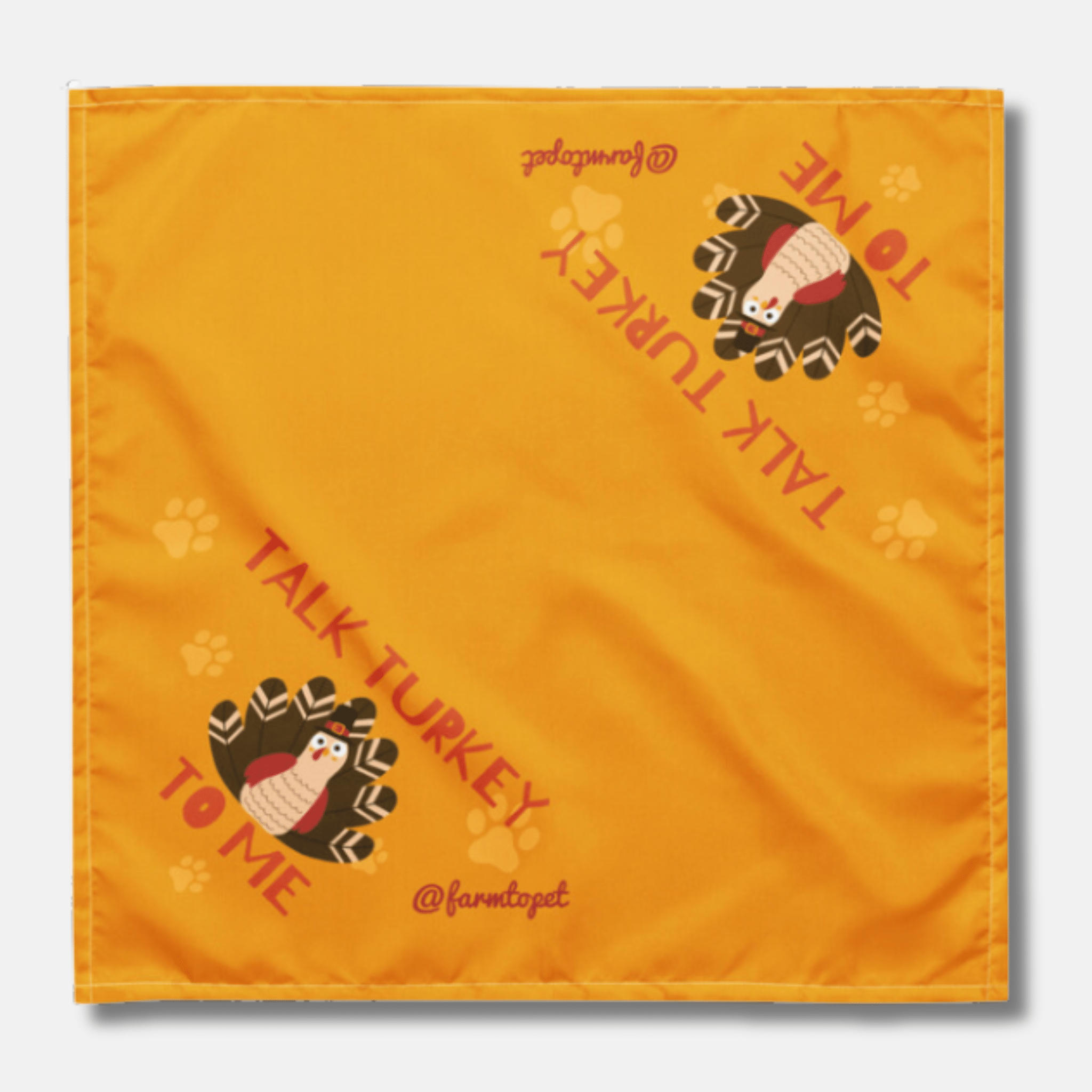 Orange dog bandana with turkey design and text on a white background from Farm to Pet