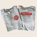 Two folded gray t-shirts showing the front and back with Farm to Pet branding on a beige background.