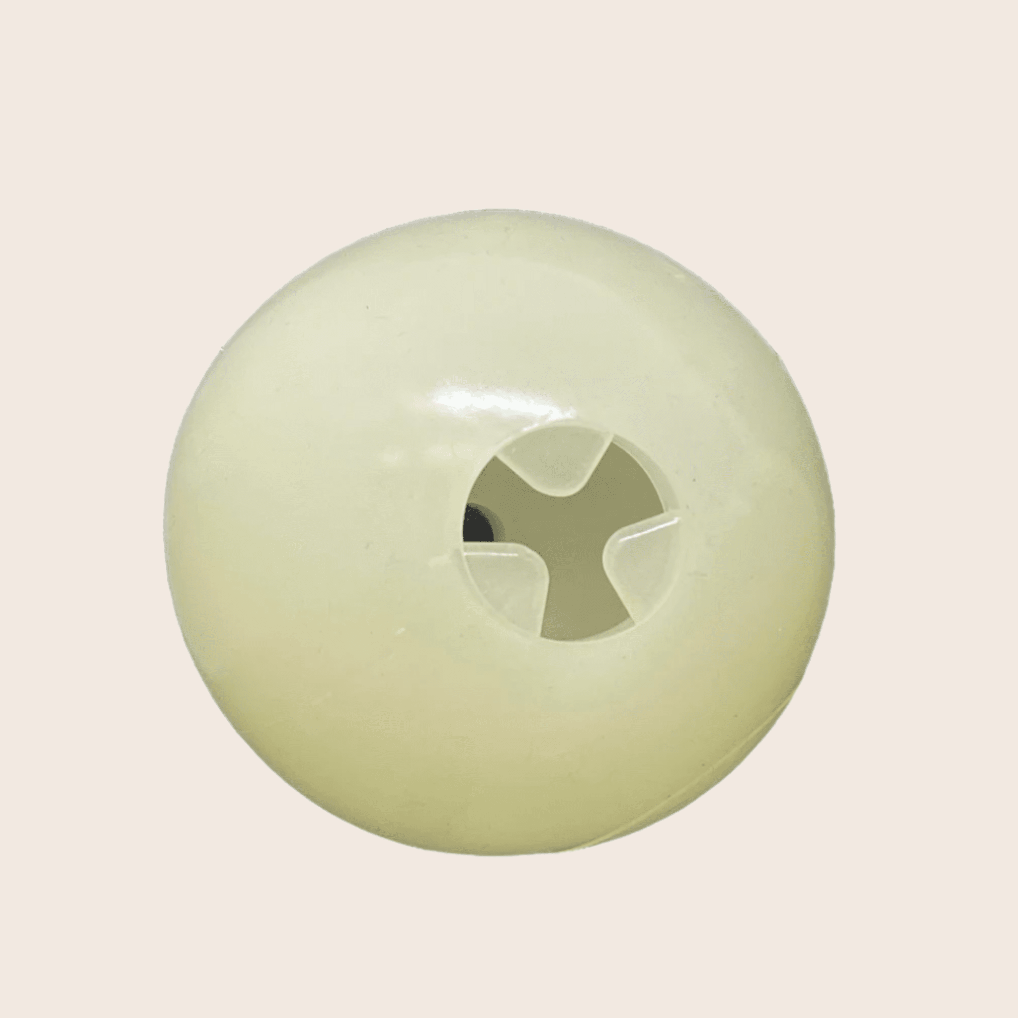 Farm to Pet Glow in the dark treat dispenser ball on beige background