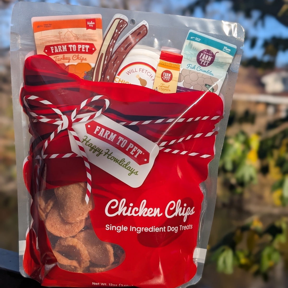Santa Sack of Farm to Pet Chicken Chips with a ribbon, single-ingredient Christmas dog treats